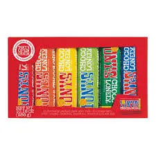 A red box of Twice as Sweet Tony's Chocoloney Variety 6 Pack 288g (Belgium) includes six Belgian chocolate bars, each in a different colorful wrapper: red, orange, yellow, blue, green, and dark blue with bold lettering.